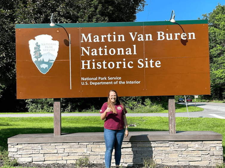 Holly Fieglein Standing in Front of Martin Van Buren Park Sign